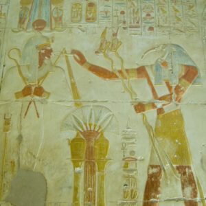 A painting of an egyptian scene with the god horus.