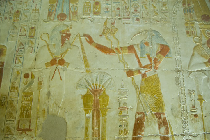 A painting of an egyptian scene with the god horus.