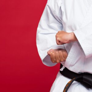 A person in white shirt and black belt